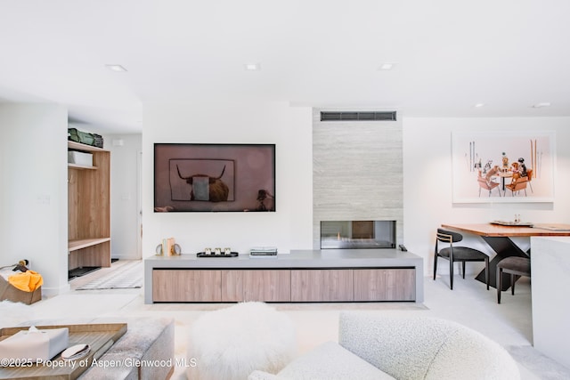 210 E Cooper Ave Unit 3G, Aspen, CO 81611 - living area with a fireplace and recessed lighting