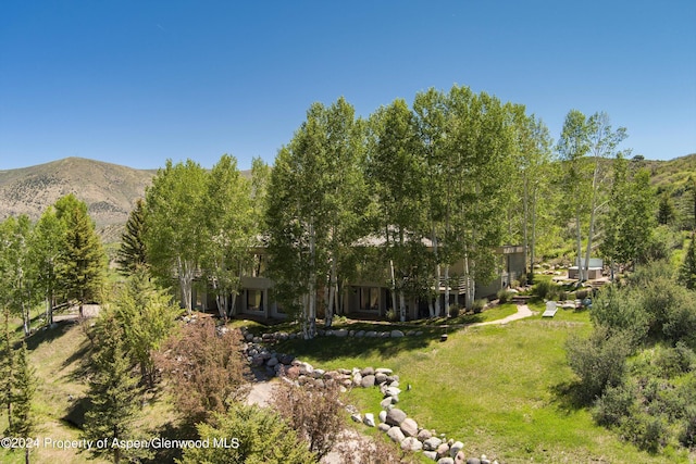 birds eye view of property with a mountain view