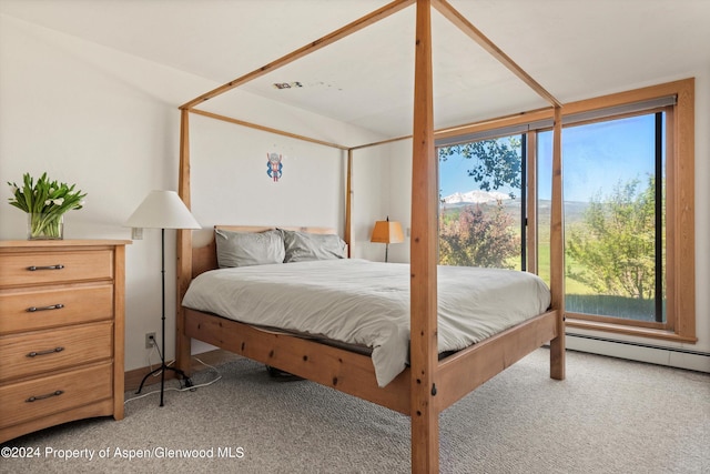 bedroom featuring carpet and baseboard heating