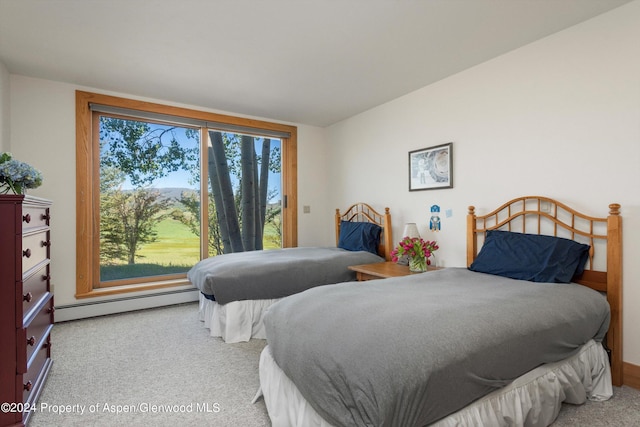 carpeted bedroom with baseboard heating