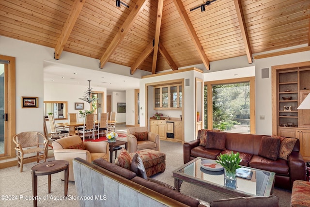 carpeted living room with beamed ceiling, wooden ceiling, and high vaulted ceiling