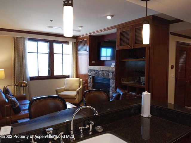 living room with a stone fireplace