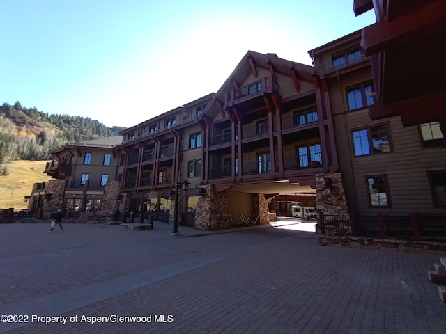 view of building exterior featuring a mountain view