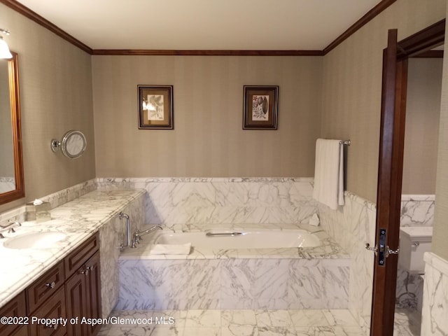 bathroom with crown molding, vanity, and a relaxing tiled tub