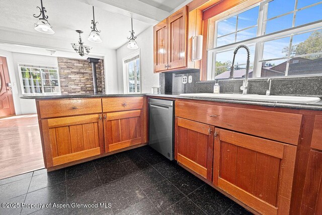 648 Colorado St, Craig, CO 81625 - kitchen featuring dishwasher, a sink, a peninsula, and plenty of natural light
