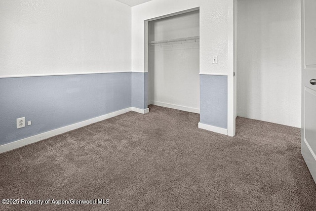 648 Colorado St, Craig, CO 81625 - unfurnished bedroom with dark colored carpet and a closet