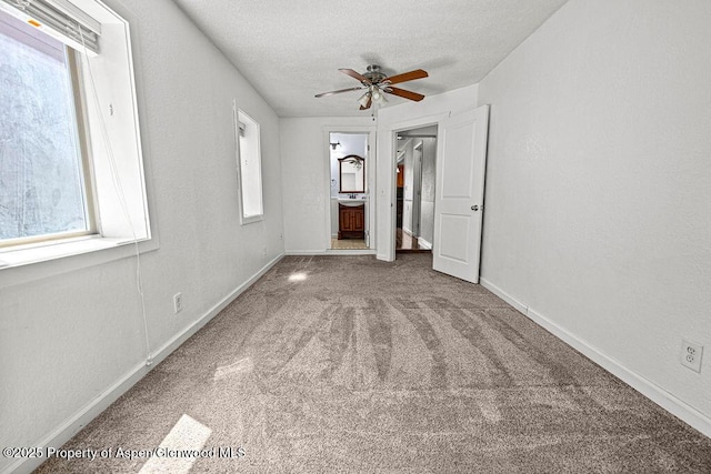 648 Colorado St, Craig, CO 81625 - unfurnished room featuring carpet, ceiling fan, baseboards, and a textured ceiling