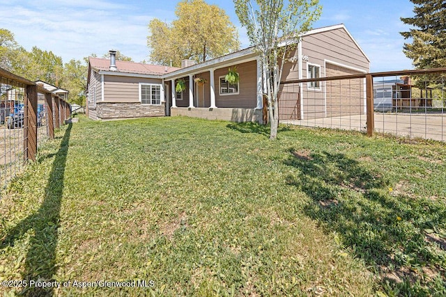 648 Colorado St, Craig, CO 81625 - rear view of house featuring metal roof and stone siding