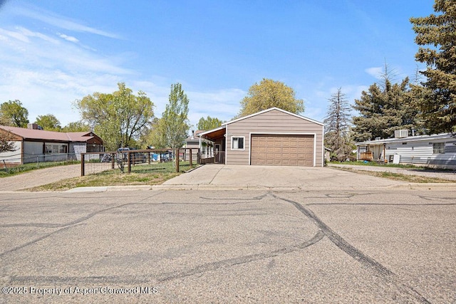648 Colorado St, Craig, CO 81625 - view of front of home featuring a detached garage and an outdoor structure