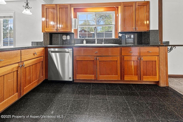 648 Colorado St, Craig, CO 81625 - kitchen with dishwasher, granite tiled floors, a sink, and decorative backsplash