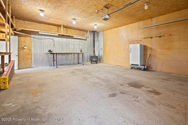 648 Colorado St, Craig, CO 81625 - garage with a wood stove and a garage door opener