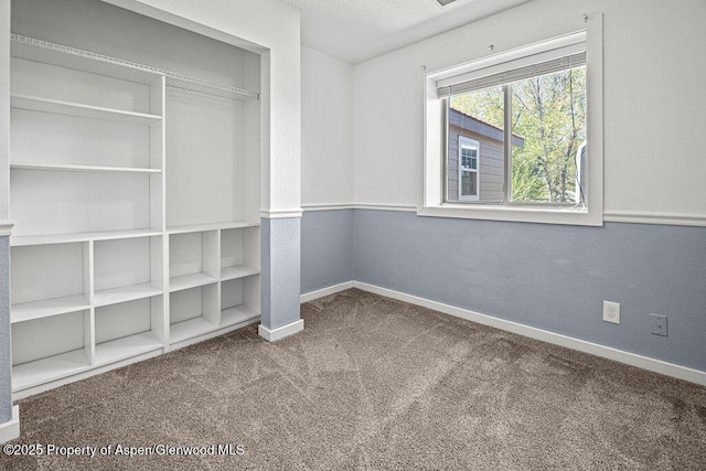 648 Colorado St, Craig, CO 81625 - unfurnished bedroom with carpet flooring, baseboards, and a closet
