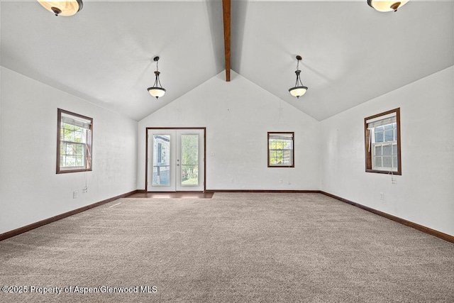 648 Colorado St, Craig, CO 81625 - carpeted empty room with healthy amount of natural light, beam ceiling, french doors, baseboards, and high vaulted ceiling