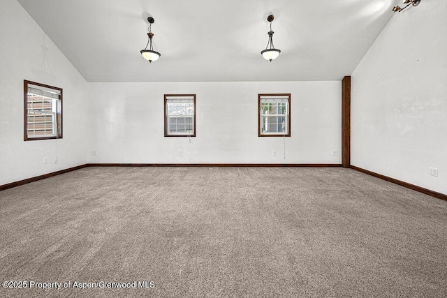 648 Colorado St, Craig, CO 81625 - spare room with carpet, baseboards, and lofted ceiling