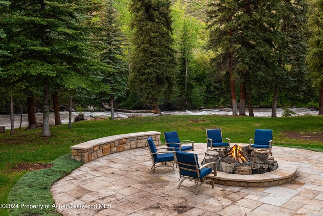 view of patio with a fire pit