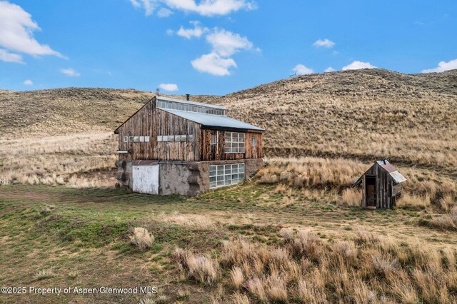 view of barn with a mountain view