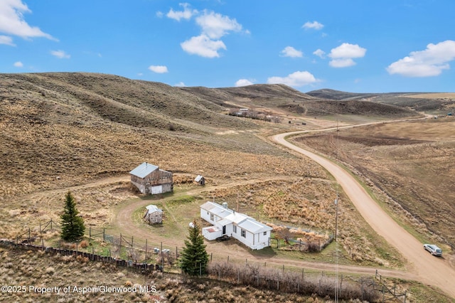 bird's eye view featuring a rural view and a mountain view