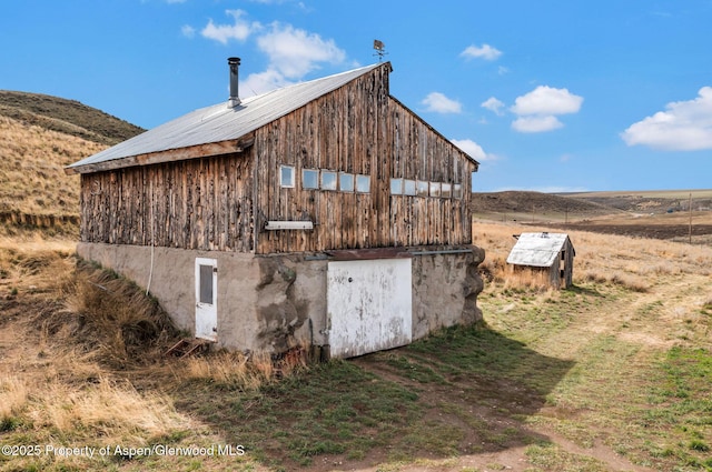 view of barn with a mountain view