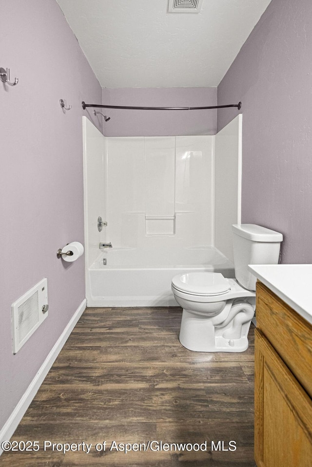 627 Lake St, Rangely, CO 81648 - full bathroom featuring vanity, wood finished floors, and bathtub / shower combination