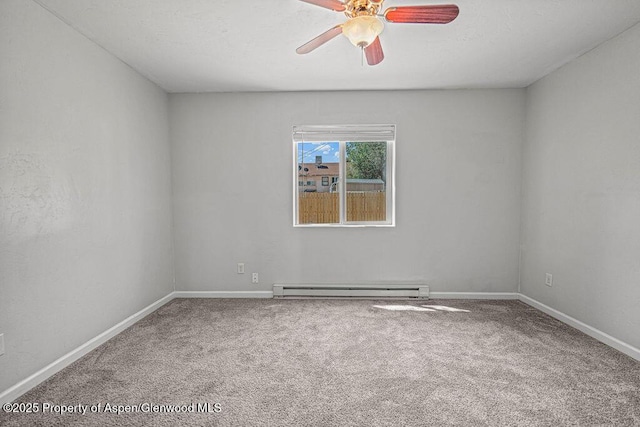 627 Lake St, Rangely, CO 81648 - carpeted empty room with a ceiling fan and a baseboard radiator