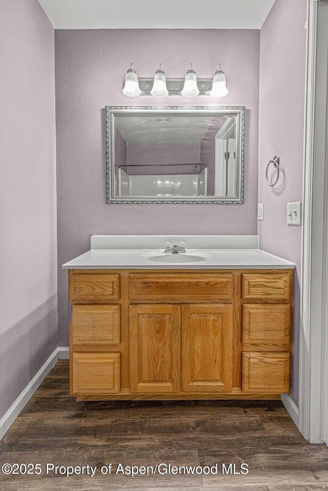 627 Lake St, Rangely, CO 81648 - full bath with vanity and wood finished floors