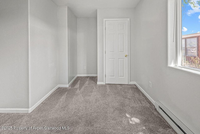 627 Lake St, Rangely, CO 81648 - bonus room with carpet flooring and a baseboard heating unit