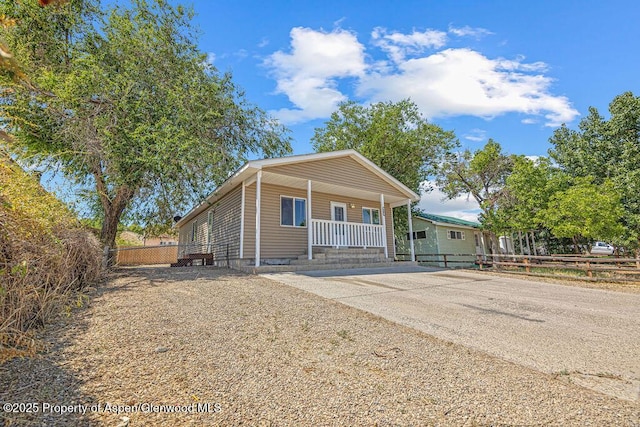627 Lake St, Rangely, CO 81648 - view of front of home featuring a porch and driveway