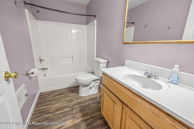 627 Lake St, Rangely, CO 81648 - bathroom featuring wood finished floors, vanity, and bathing tub / shower combination