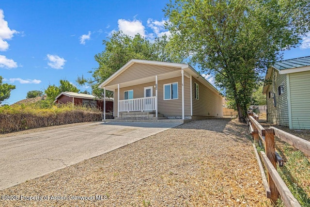 627 Lake St, Rangely, CO 81648 - bungalow with a porch and concrete driveway