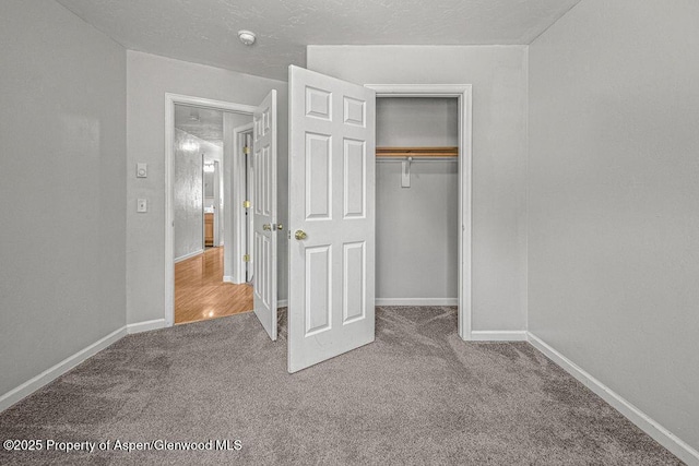 627 Lake St, Rangely, CO 81648 - unfurnished bedroom featuring carpet floors and a closet