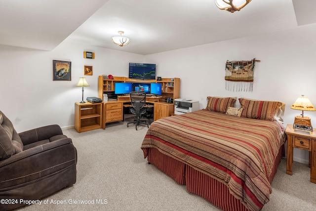 bedroom featuring light carpet