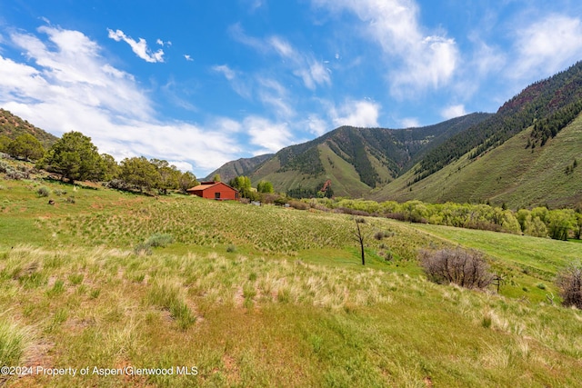 view of mountain feature with a rural view