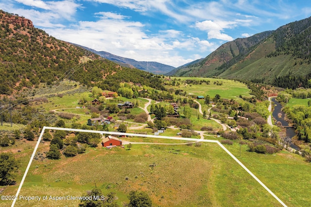 mountain view featuring a rural view