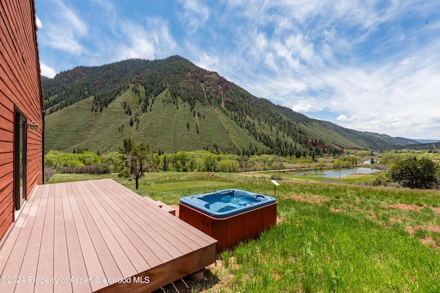 view of mountain feature featuring a water view