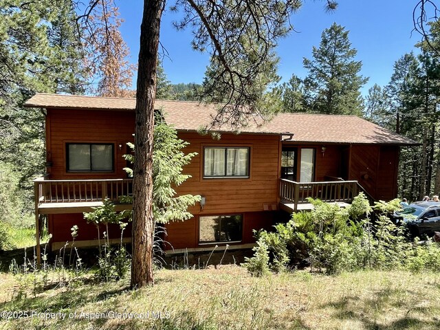 6616 High Dr, Morrison, CO 80465 - chalet / cabin featuring stairway, roof with shingles, and a deck