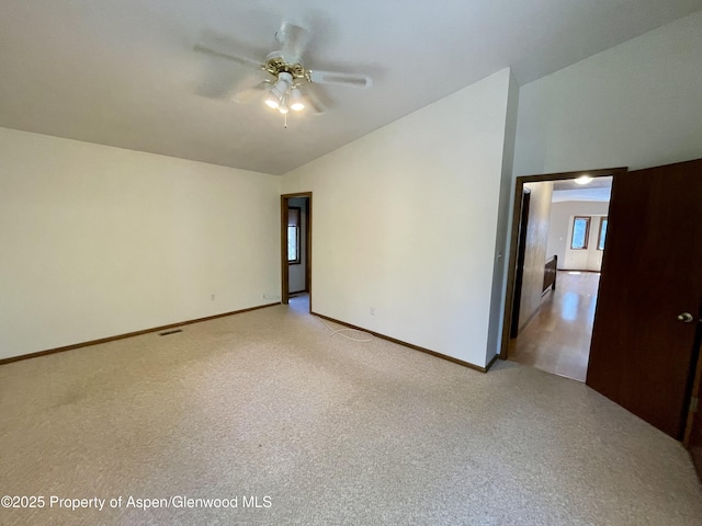 6616 High Dr, Morrison, CO 80465 - spare room with vaulted ceiling, ceiling fan, and light carpet