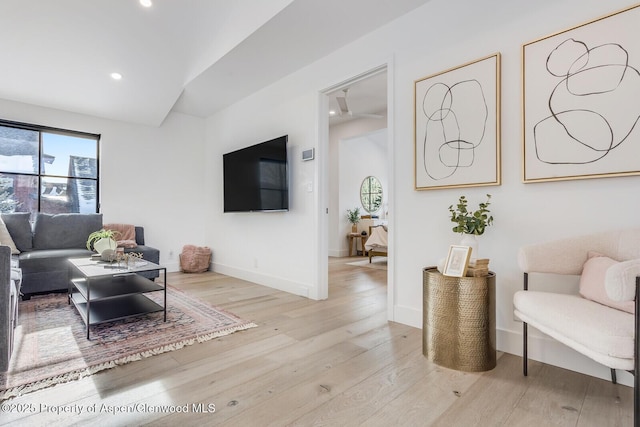 living room with light hardwood / wood-style flooring