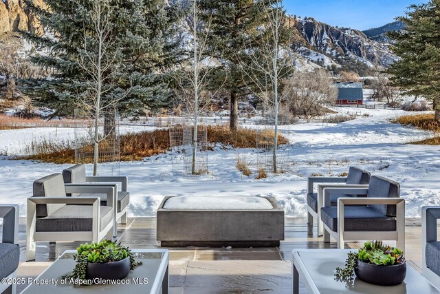 snowy yard featuring a mountain view