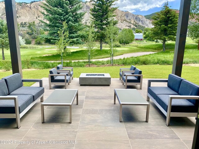 view of patio / terrace featuring outdoor lounge area and a mountain view