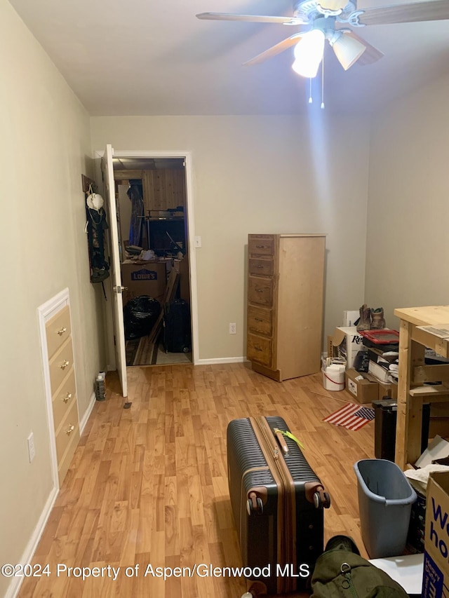 interior space with ceiling fan, a closet, and light hardwood / wood-style flooring