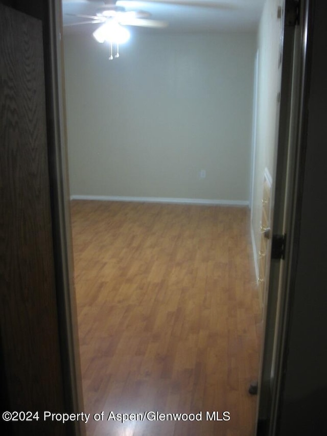 unfurnished room with hardwood / wood-style flooring