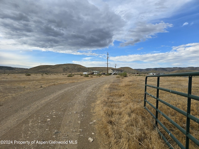 view of road with a mountain view and a rural view