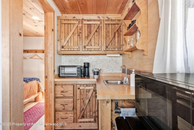 1210 County Road 103, Craig, CO 81625 - kitchen with wooden ceiling, a sink, backsplash, and light countertops