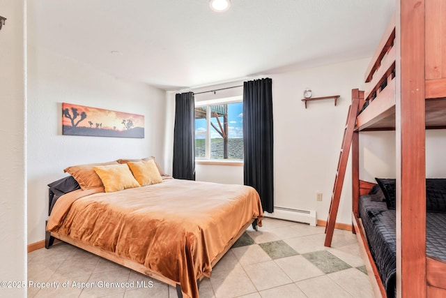 1210 County Road 103, Craig, CO 81625 - bedroom with a baseboard radiator, light tile patterned floors, a water view, and baseboards