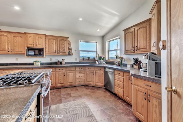 1210 County Road 103, Craig, CO 81625 - kitchen with appliances with stainless steel finishes, a sink, dark countertops, and recessed lighting