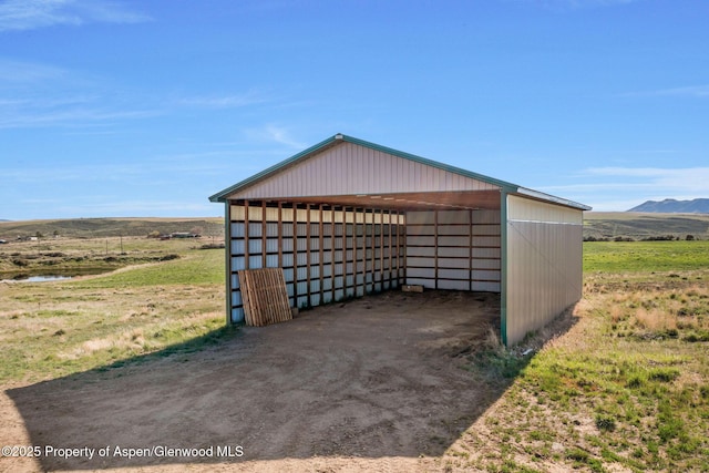 1210 County Road 103, Craig, CO 81625 - garage with a detached carport and a mountain view