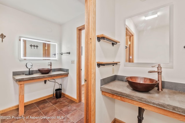 1210 County Road 103, Craig, CO 81625 - bathroom featuring a sink, baseboards, and tile patterned floors