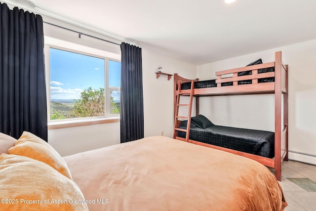 1210 County Road 103, Craig, CO 81625 - bedroom featuring tile patterned flooring and a baseboard heating unit