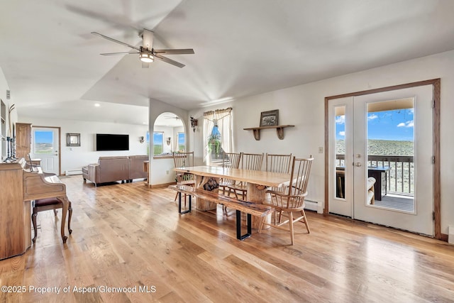 1210 County Road 103, Craig, CO 81625 - dining area featuring baseboard heating, a ceiling fan, light wood-type flooring, arched walkways, and lofted ceiling
