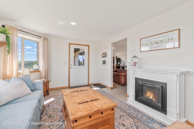 1210 County Road 103, Craig, CO 81625 - living room with baseboards, a glass covered fireplace, recessed lighting, and light tile patterned floors
